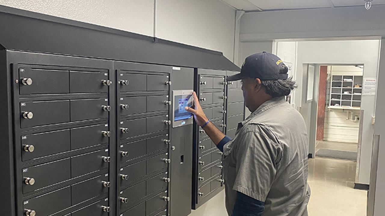 Physical Plant Mechanic Luis “Bobby” Gallardo uses the touchscreen interface of an electronic smart key cabinet system installed at UC Davis Facilities Management.