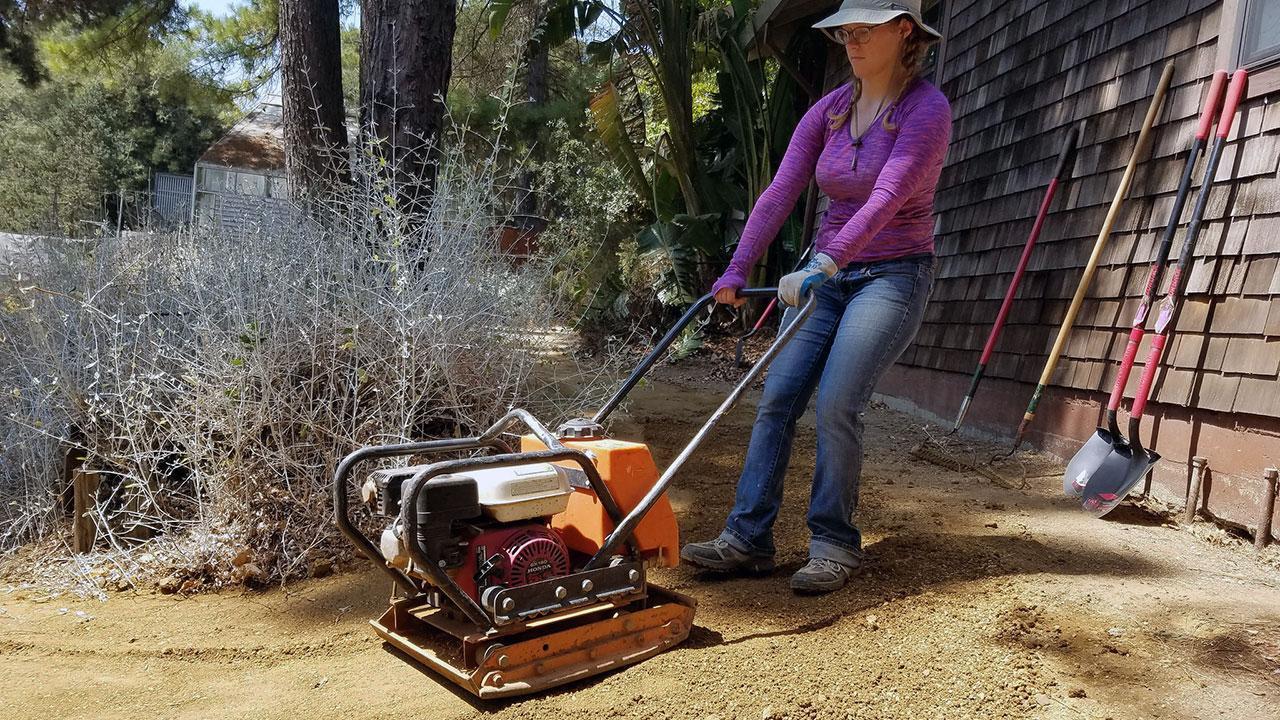 Photo of person conducting path repairs.