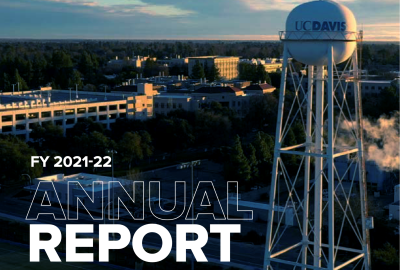 Cover of the 2021-22 Annual Report, the UC Davis water tower and an aerial view of the campus.