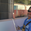 Photo of worker installing plexiglass
