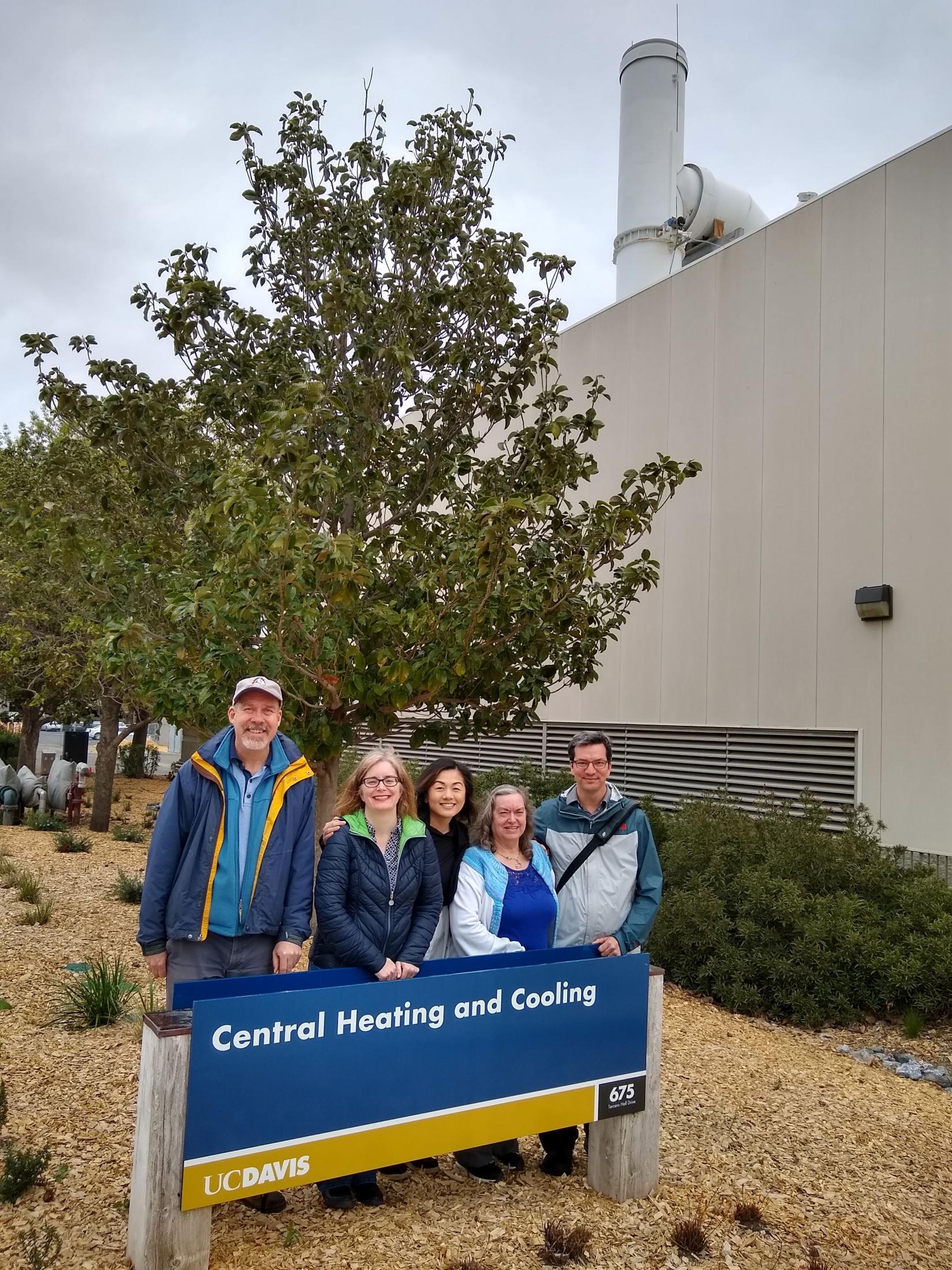 A tour group takes a photo outside the CHCP